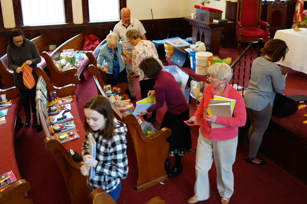 Preparing school kits for Church World Service. Preparing school kits for Church World Service.